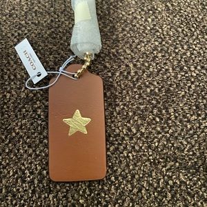 Coach star charm